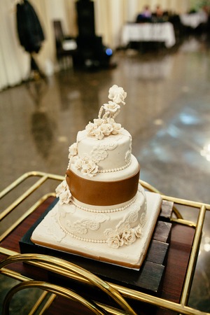 delicious white and brown wedding cake.の写真素材