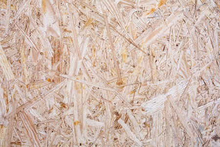 Surface of Pressed Wood Close up. Particleboard Background Texture.