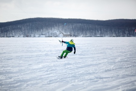 Men ski kiting on a frozen lake.の写真素材