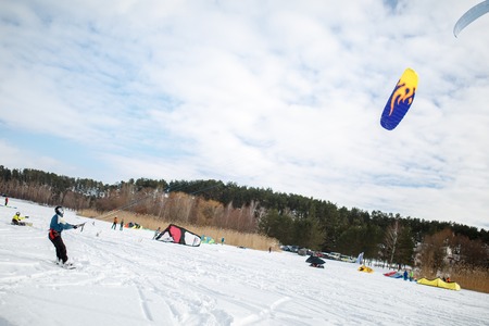 Men ski kiting on a frozen lake.の写真素材