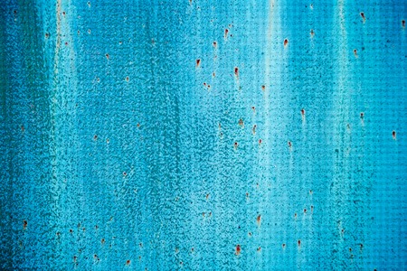 Cracked painted old metal texture. Blue color. Rusted surfaceの写真素材