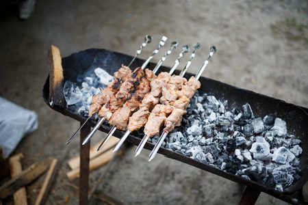 Meat is fried on a brazier. Meeting with friends.の写真素材