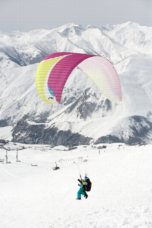 Winter paragliding in Gudauri mountains.の写真素材