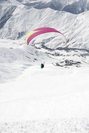 Winter paragliding in Gudauri mountains.の写真素材