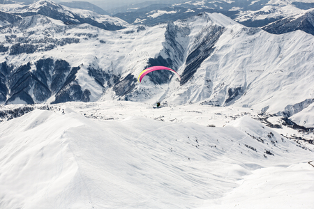 Winter paragliding in Gudauri mountains.の写真素材
