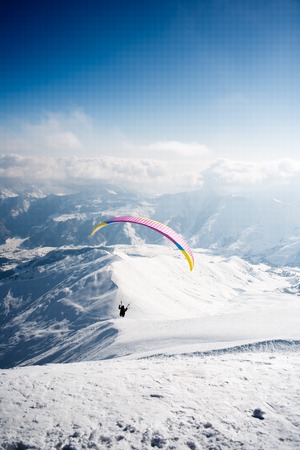 Winter paragliding in Gudauri mountains.の写真素材