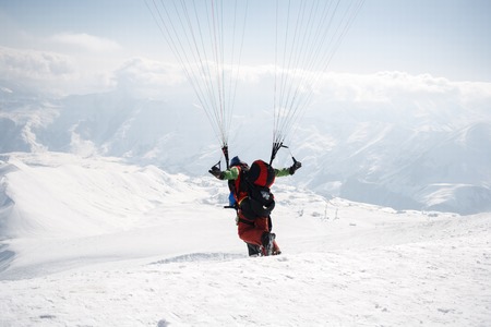 Winter paragliding in Gudauri mountains.の写真素材