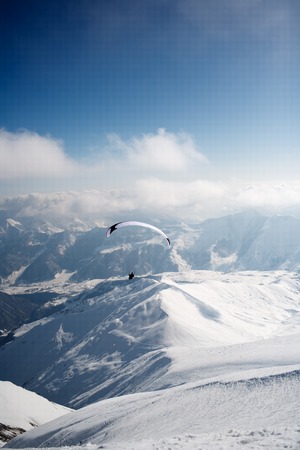 Winter paragliding in Gudauri mountains.の写真素材