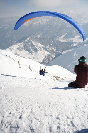 Winter paragliding in Gudauri mountains.の写真素材