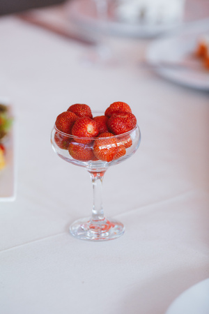Fresh strawberries in a transparent container.の写真素材