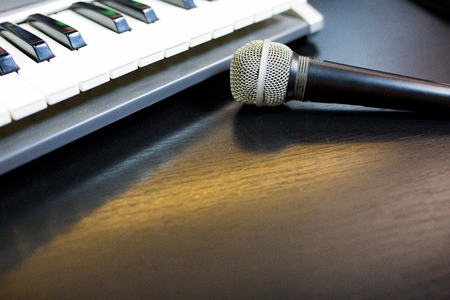Image of keyboard with microphone on black backgroundの写真素材