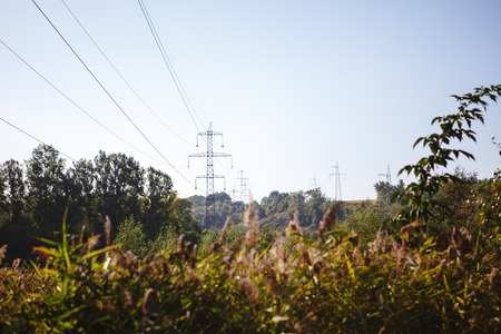High-voltage lines. Electric line among nature.の写真素材