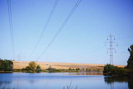 High-voltage lines. Electric line among nature.