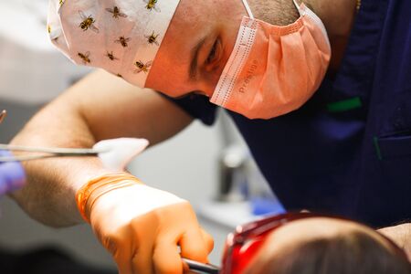Dental treatment at dentist's office before removal of a tooth.のeditorial素材