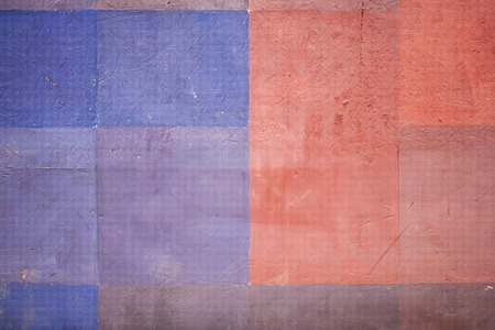 Colorful stone wall texture background. Red and blue.