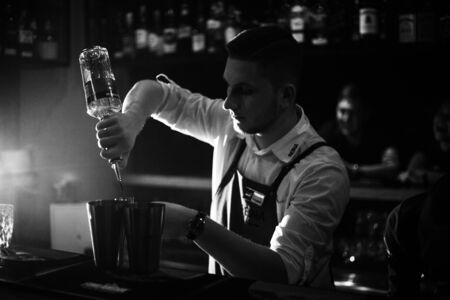 KHARKOV, UKRAINE - APRIL 26, 2019: Bartender prepares a cocktail at the barのeditorial素材