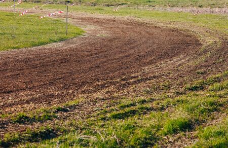 Turn of atv race track. Dust and grass.の写真素材