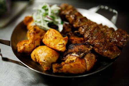 Plate with different fried meat.