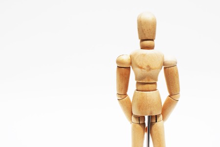 Wooden mannequin human scale model isolatedの写真素材
