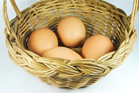 many of fresh eggs in vintage style basketの写真素材