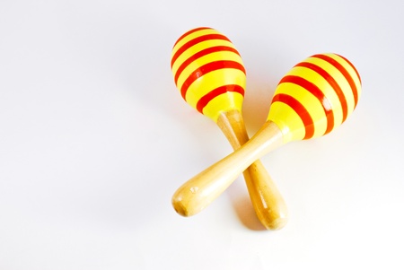colorful wooden toy maracas music percussion instrument on white backgroundの写真素材