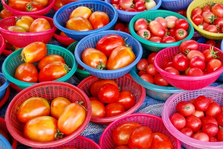 many of fresh tomato in basket in fresh market , Asia , Thailandの写真素材
