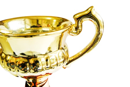 Golden trophy closeup isolated on white backgroundの写真素材