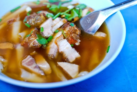Asian style boiled square pasta soup with porkの写真素材