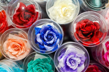 colorful fake rose flower sale in marketの写真素材