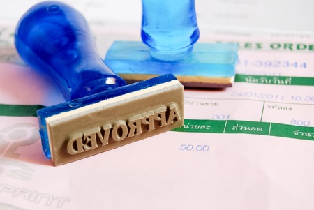 approve letter on rubber stamp with business cash receipt backgroundの写真素材