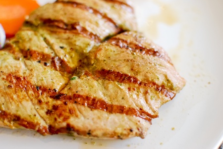 grilled pork steak set with french fries and vegetableの写真素材