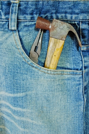 repairman jean with tool in the pocket closeup backgroundの写真素材