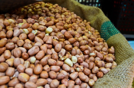 Peanut raw nuts , closeup background