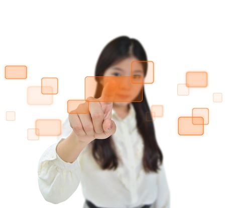 Business woman pressing on a flow of buttonsの写真素材