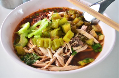 Asian style noodle with chicken and bitter soup