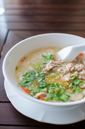 Rice porridge with pork and vegetable soupの写真素材