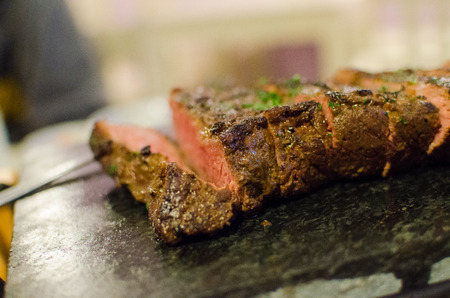 Grilled beef medium steak with parsleyの写真素材