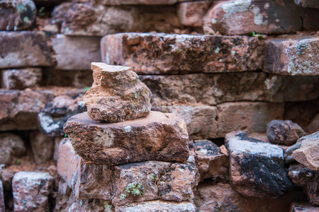 Old and broken red stone brick wall, close up details background