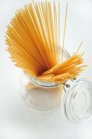 Bunch of spaghetti in a glass jarの写真素材