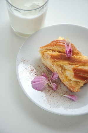 Brioche and glass of milkの写真素材