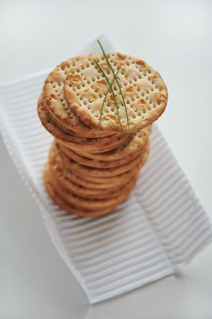 Pile of round crackers with chivesの写真素材