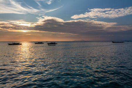 Beautiful image of sunset with colorful sky and boats on the sea. Malaysiaの写真素材