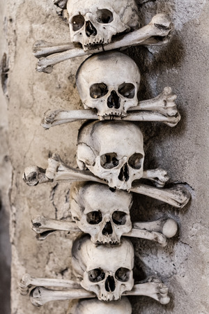 Five Skulls and bones in the bone chapel in Sedlec, Kutna Hora, Czech Republicの写真素材