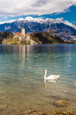 Amazing View On Bled Lake, Island,Church And Castle With Mountain Range Stol, Vrtaca, Begunjscica In The Background-Bled,Slovenia,Europeのeditorial素材