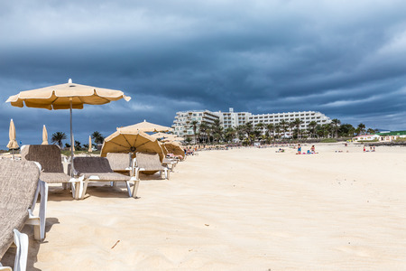 Hotel And Sunbeds On Corralejo Beach - Corralejo, Fuerteventura, Canary Islands, Spainの写真素材