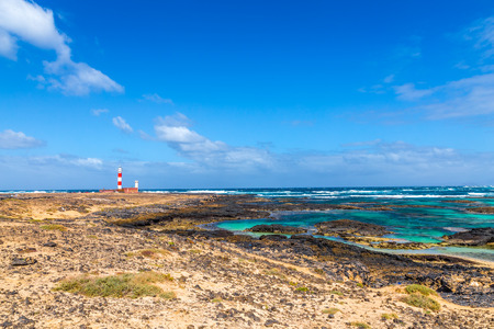 Toston Lighthouse And Rocky Seashore - El Cotillo, Fuerteventura, Canary Islands, Spainの写真素材