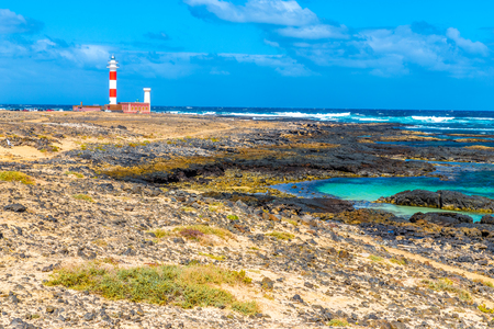 Toston Lighthouse And Rocky Seashore - El Cotillo, Fuerteventura, Canary Islands, Spainの写真素材