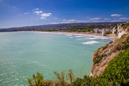 Castle Beach With Vertical Rocky Monolith Pizzomunno - Vieste, Gargano Peninsula, Apulia region, Italy, Europeの写真素材