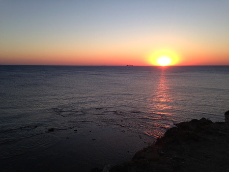 A beautiful sunset view with the sun from the seaの写真素材