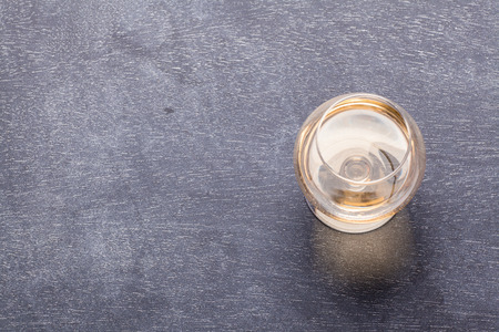 Snifter glass with brandy on a classic textured blackboard